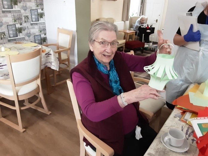 Resident holding paper lantern